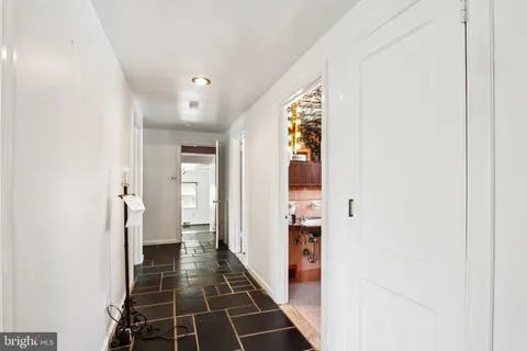 a view of an entryway with wooden floor