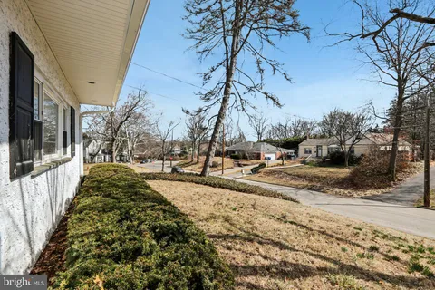 a house that has tree in front of it
