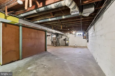 a view of empty room with wooden walls