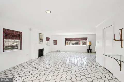 a bedroom with a bed and a chair