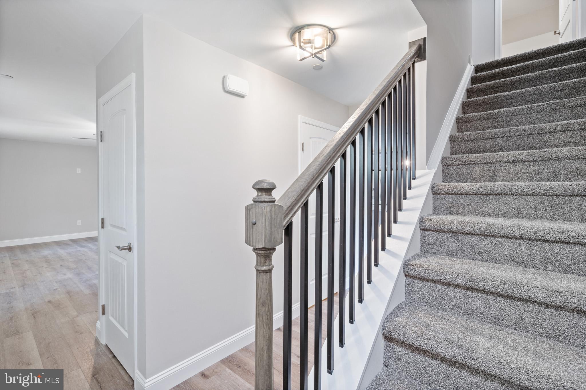 24215 Thistle Place Chaptico, MD 20621 - Photo 18 of 40 a view of staircase with railing and white walls