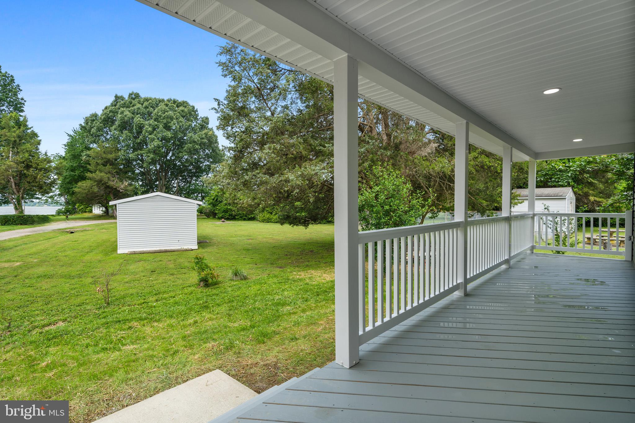 24215 Thistle Place Chaptico, MD 20621 - Photo 2 of 40 a view of a deck with a yard