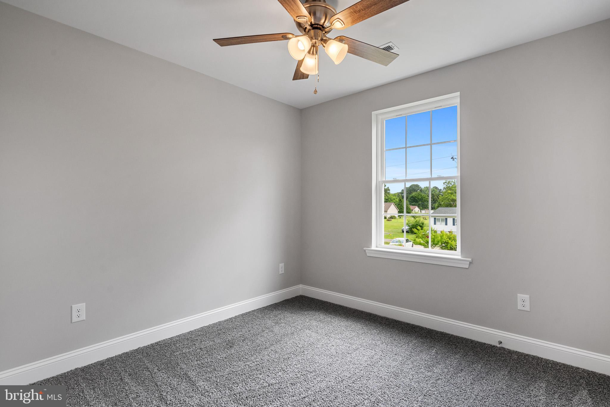 24215 Thistle Place Chaptico, MD 20621 - Photo 25 of 40 an empty room with a window and a fan