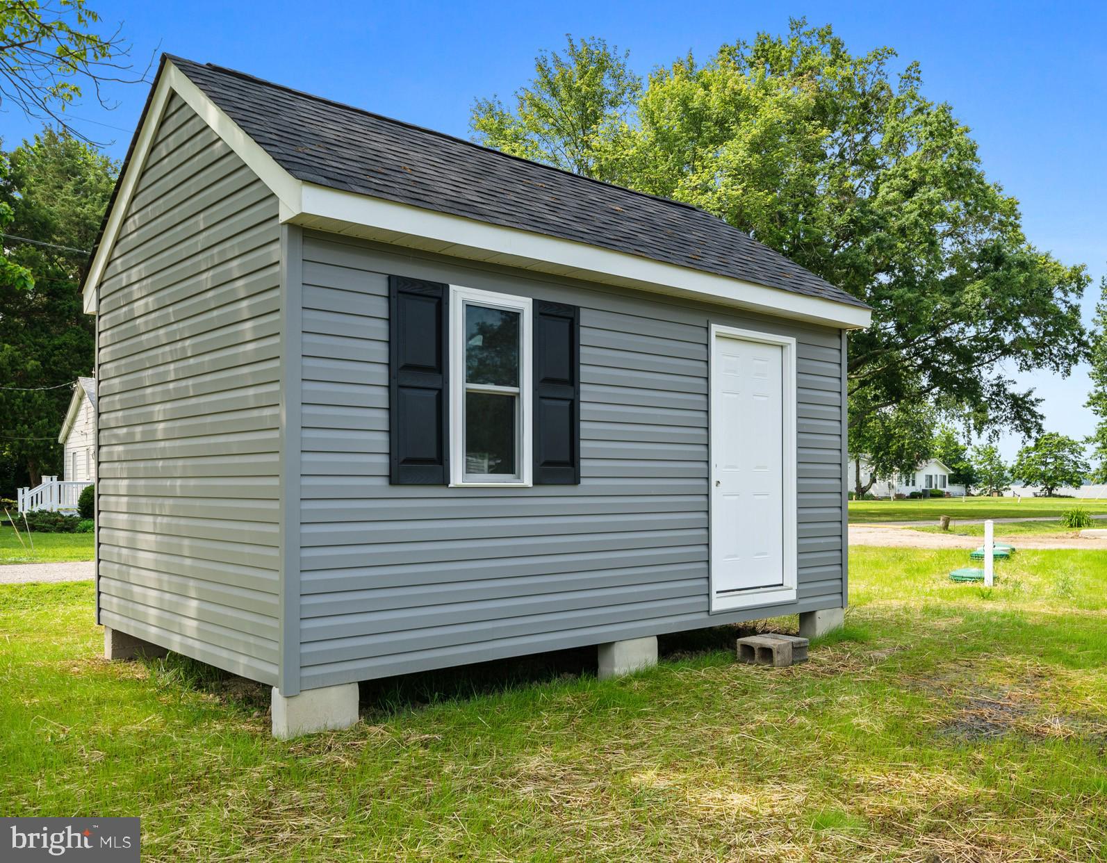 24215 Thistle Place Chaptico, MD 20621 - Photo 30 of 40 a view of a house with a backyard