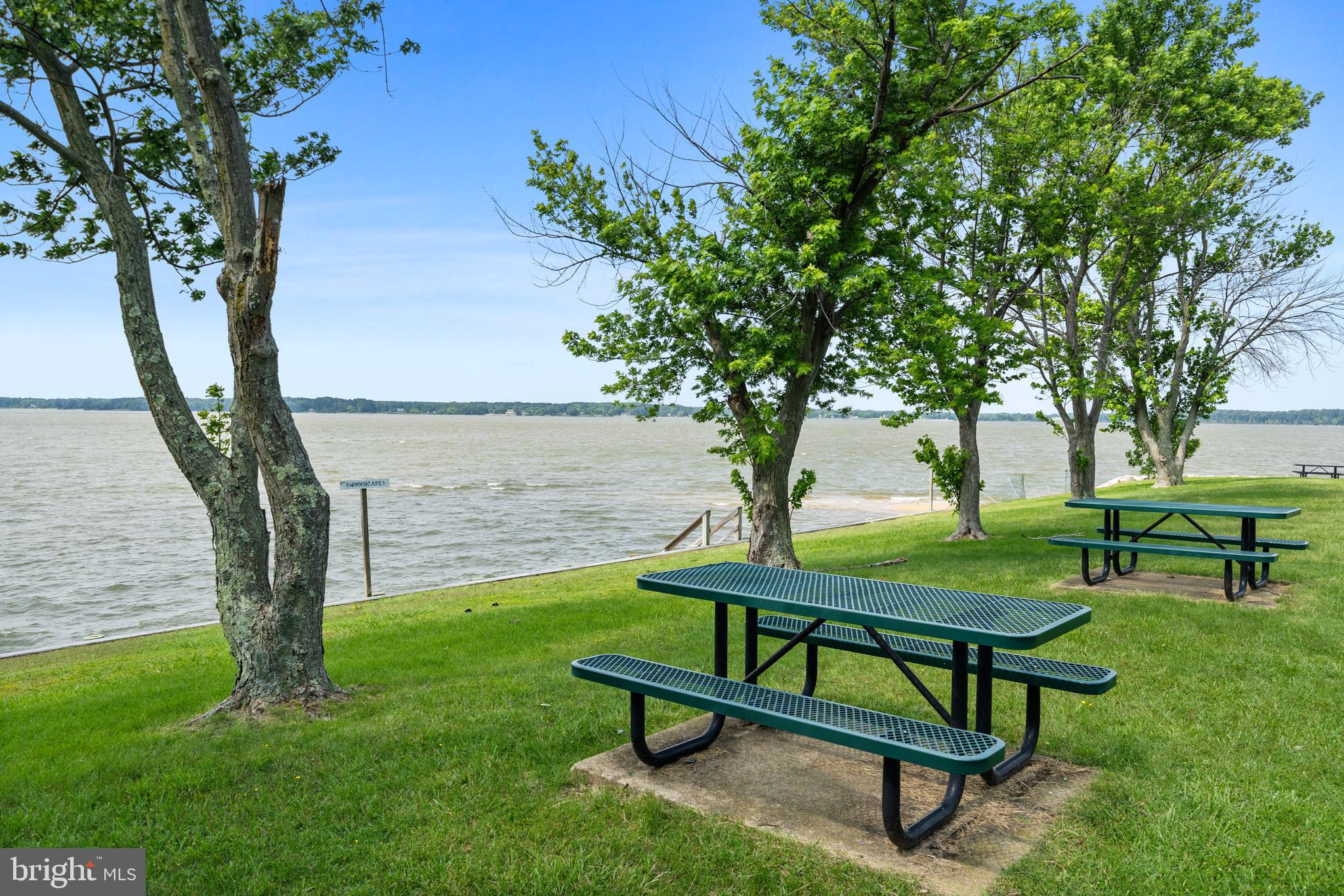 24215 Thistle Place Chaptico, MD 20621 - Photo 36 of 40 a view of a bench in the garden near a tree