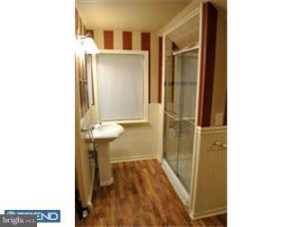 201 Stone Road Lindenwold, NJ 08021 - Photo 8 of 12 a bathroom with a sink and a mirror