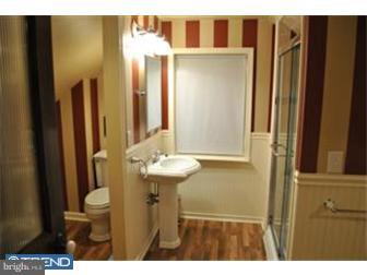201 Stone Road Lindenwold, NJ 08021 - Photo 9 of 12 a bathroom with a sink a toilet and shower