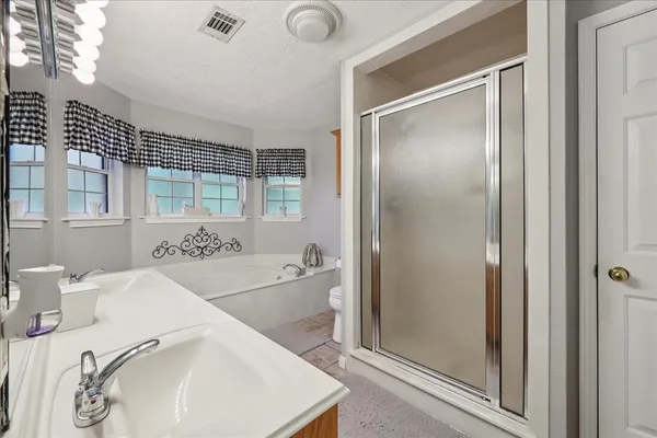 a bathroom with a sink and a bathtub
