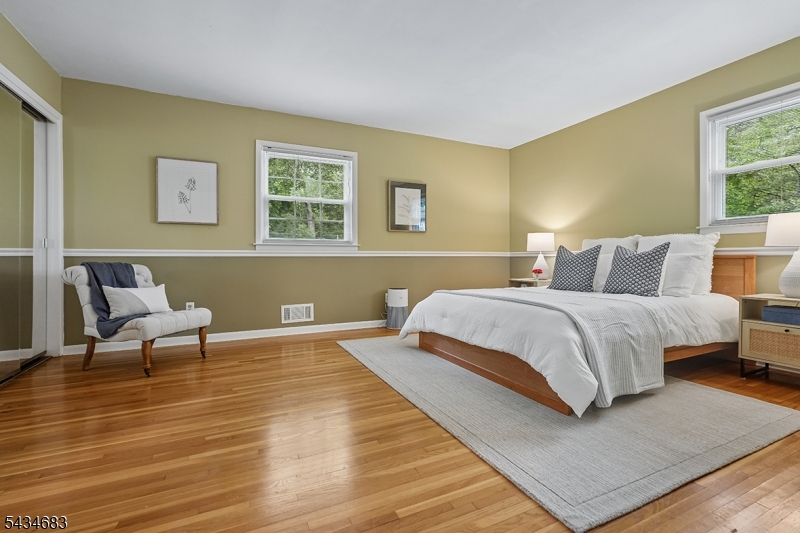 106 Division Avenue Summit, NJ 07901 - Photo 16 of 38 a bedroom with a bed and window
