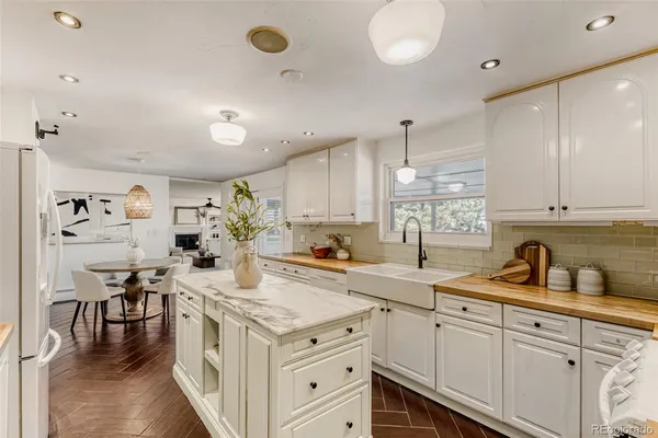 a kitchen with a sink stove and cabinets