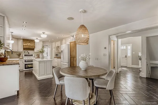 a kitchen with a table and chairs in it