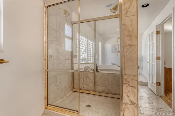 a bathroom with a glass shower door