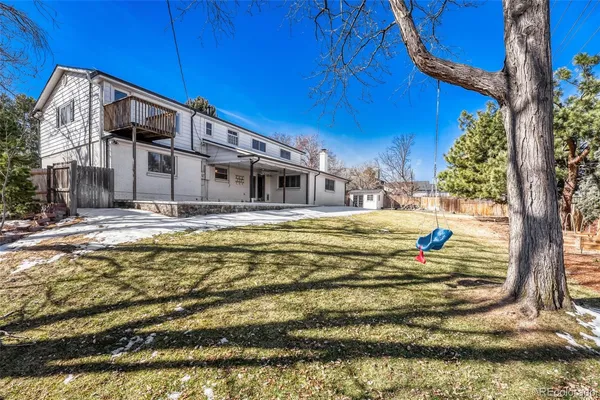 a view of an empty room with a floor to ceiling windows and yard