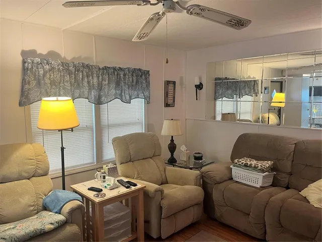 a living room with furniture and a lamp