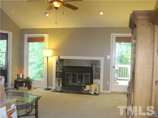 4505 Cobbler Place Raleigh, NC 27613 - Photo 6 of 13 a living room with furniture and a fireplace