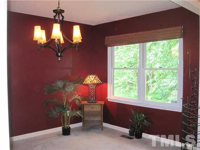 4505 Cobbler Place Raleigh, NC 27613 - Photo 7 of 13 a view of a livingroom with furniture and a window