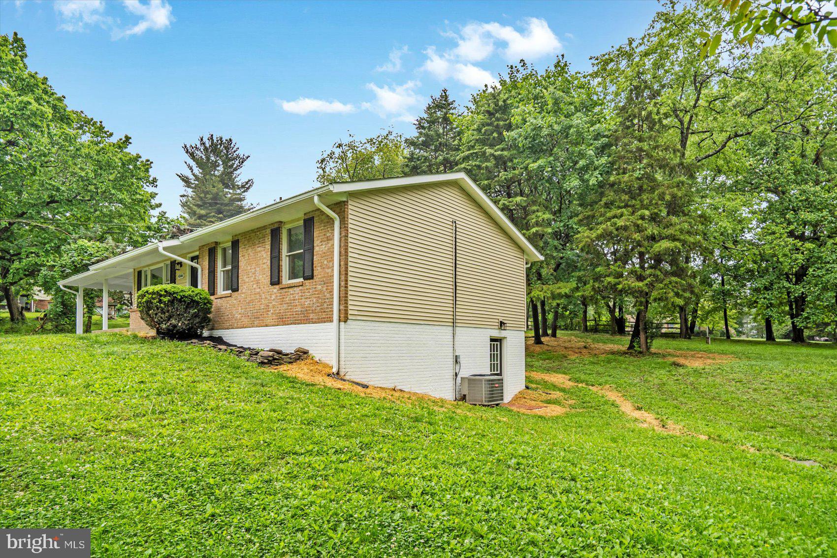4566 Hickory Lane Mount Airy, MD 21771 - Photo 11 of 45 a view of a backyard with a garden