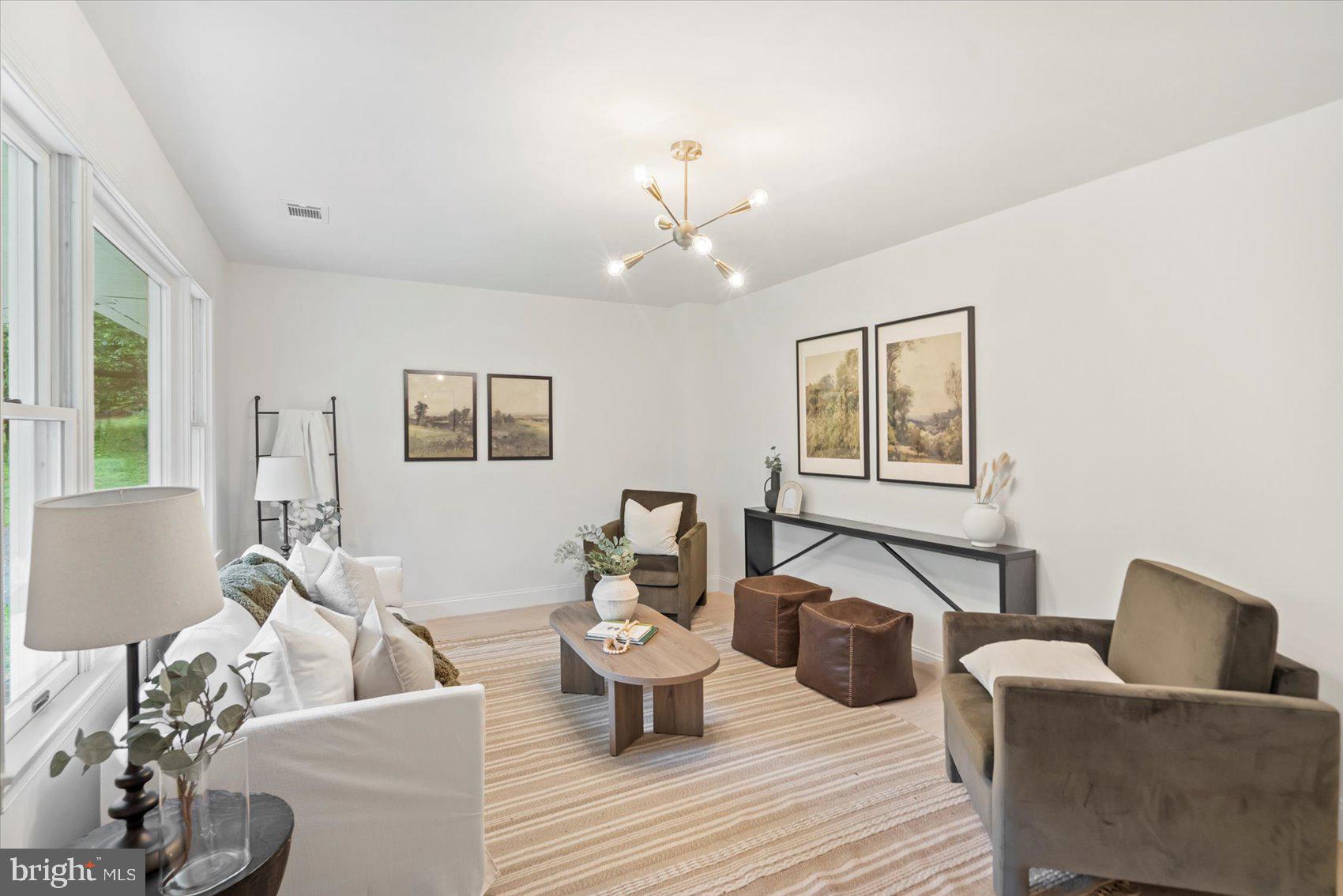 4566 Hickory Lane Mount Airy, MD 21771 - Photo 14 of 45 a living room with furniture and a wooden floor