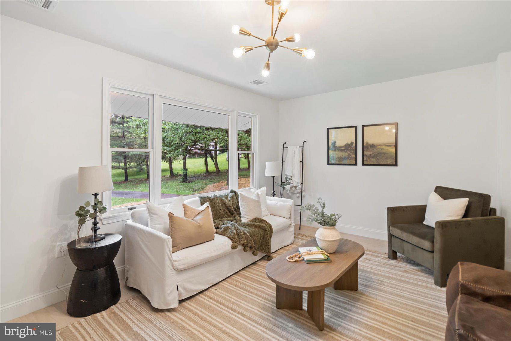 4566 Hickory Lane Mount Airy, MD 21771 - Photo 16 of 45 a living room with furniture and a large window