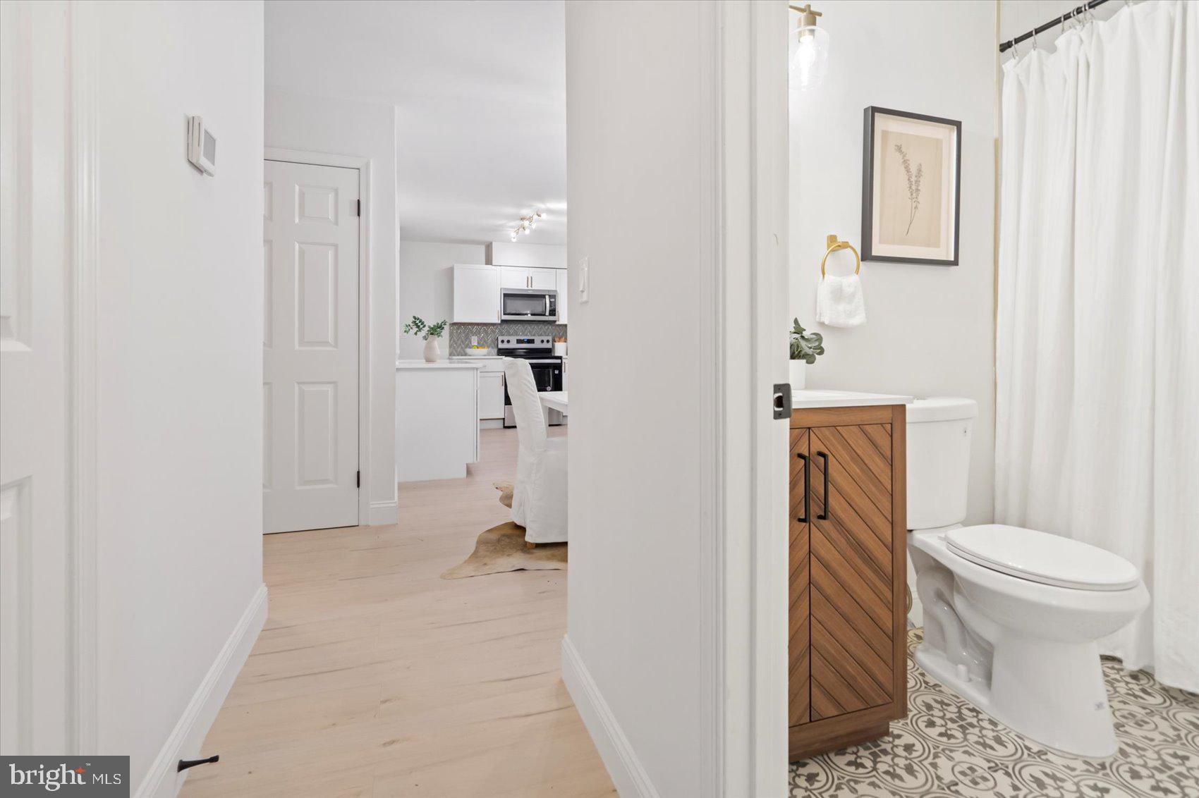 4566 Hickory Lane Mount Airy, MD 21771 - Photo 29 of 45 a bathroom with a toilet sink and shower