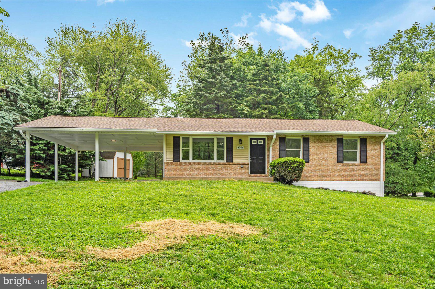4566 Hickory Lane Mount Airy, MD 21771 - Photo 3 of 45 a view of a house with a yard and sitting area