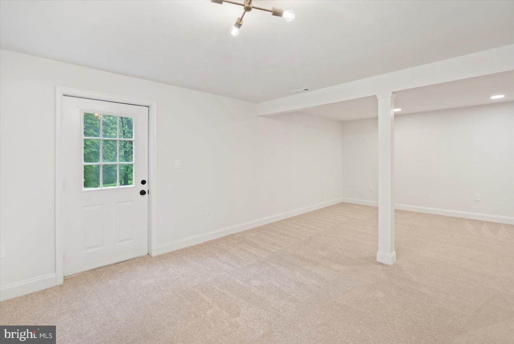 4566 Hickory Lane Mount Airy, MD 21771 - Photo 40 of 45 an empty room with a empty space and windows
