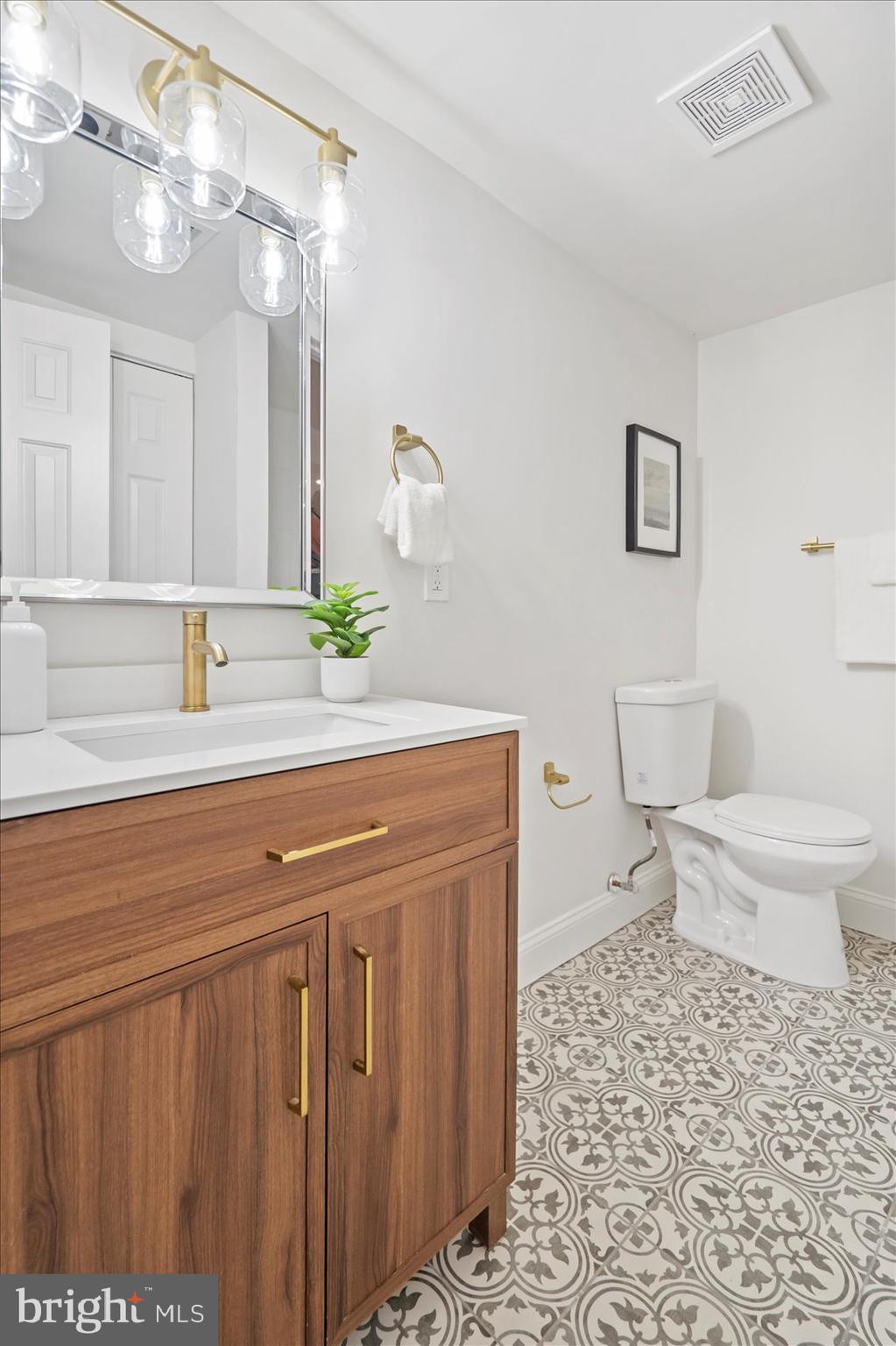 4566 Hickory Lane Mount Airy, MD 21771 - Photo 44 of 45 a bathroom with a sink toilet and shower