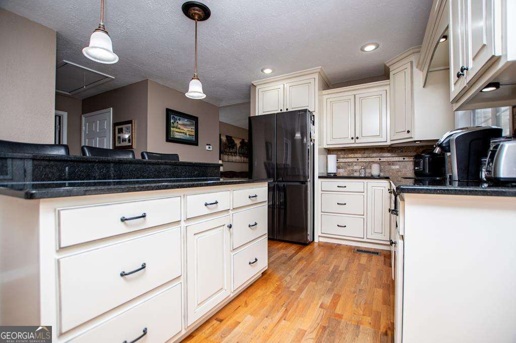 2 Pine Hill Drive Ranburne, AL 36273 - Photo 28 of 91 a kitchen with stainless steel appliances a refrigerator sink and cabinets