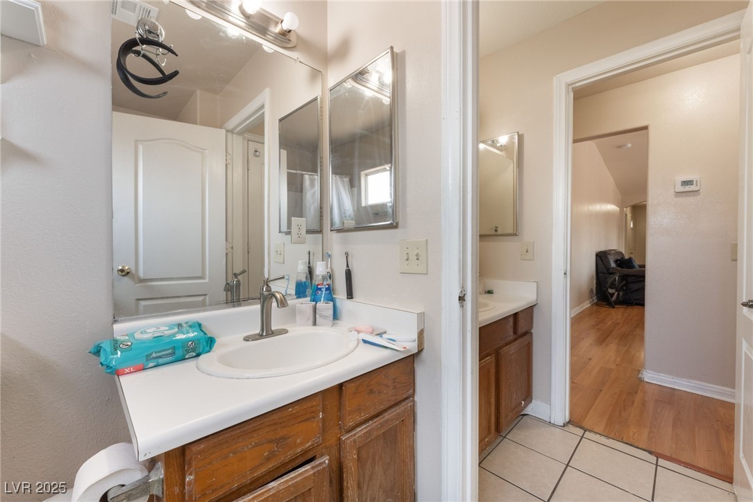 4656 East Desert Inn Road Las Vegas, NV 89121 - Photo 48 of 98 4650 E DI Bathroom with vanity and tile patterned flooring