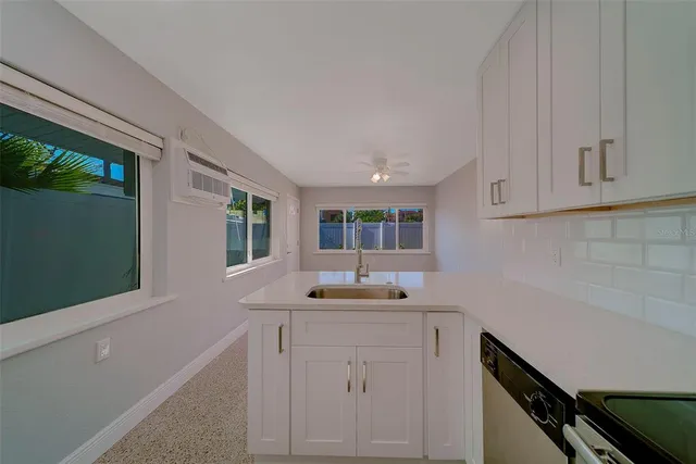a kitchen with appliances and cabinets
