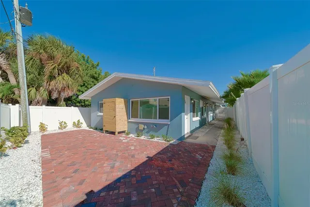 a view of a backyard of the house