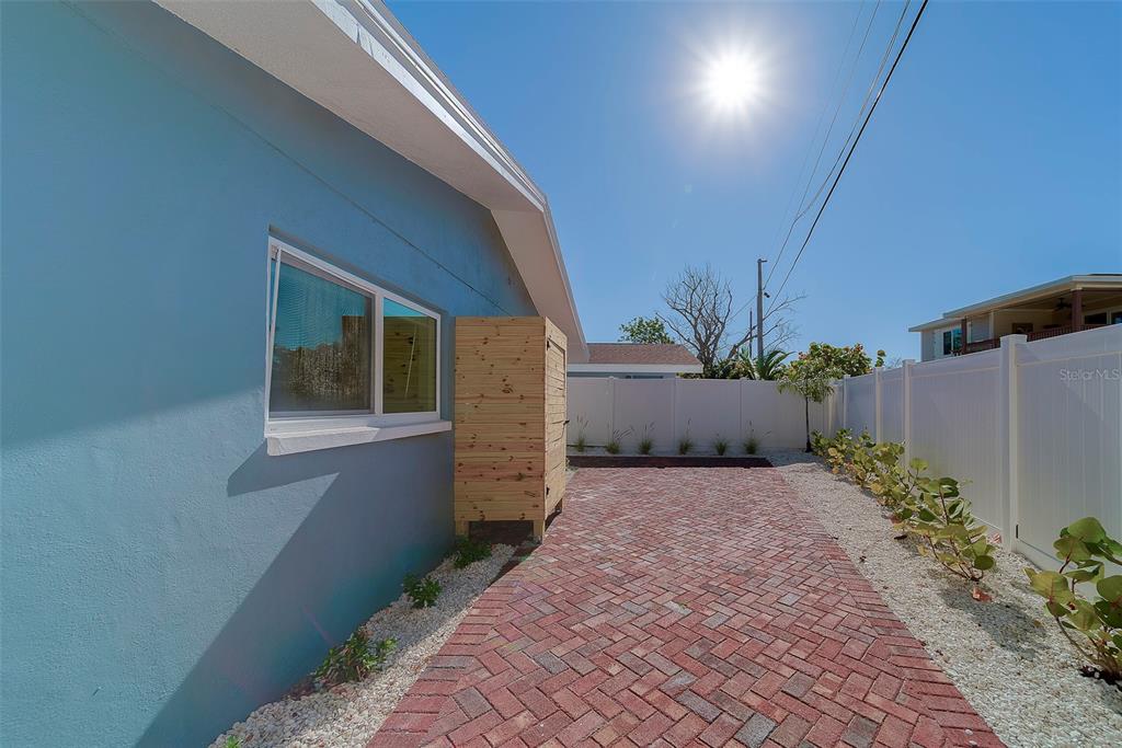13248 4th Street East, Unit B Madeira Beach, FL 33708 - Photo 27 of 49 a view of a backyard of the house