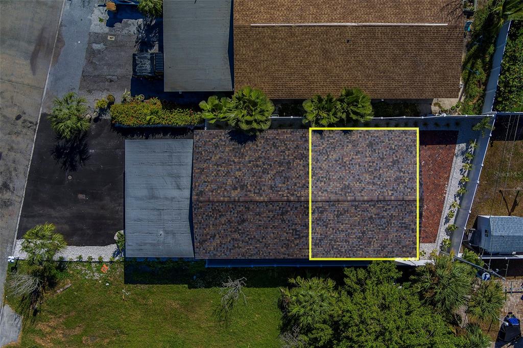 13248 4th Street East, Unit B Madeira Beach, FL 33708 - Photo 3 of 49 front view of a house with a yard