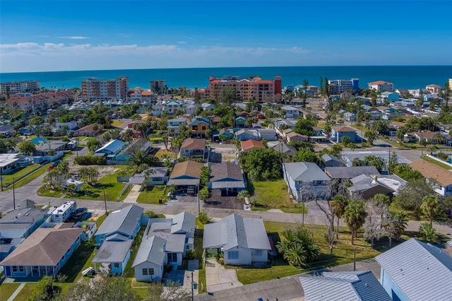 an aerial view of a house with a lake view