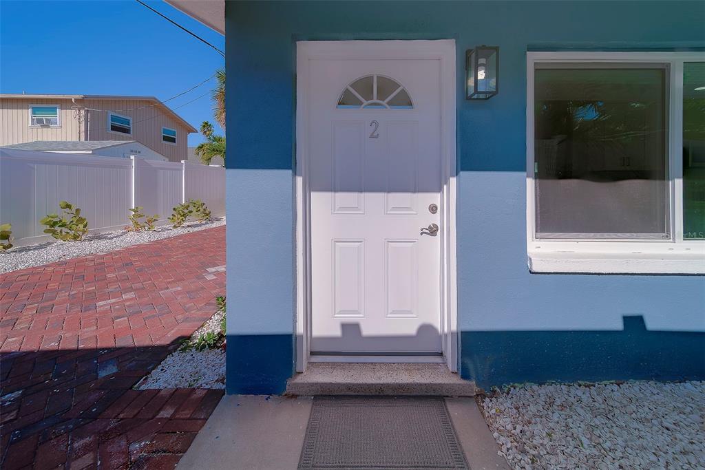 13248 4th Street East, Unit B Madeira Beach, FL 33708 - Photo 5 of 49 a door view with a outdoor space