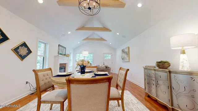 a dining room with furniture and a window