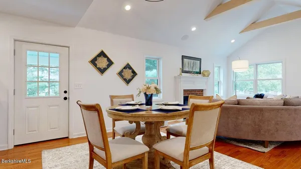 a dining room with furniture and window