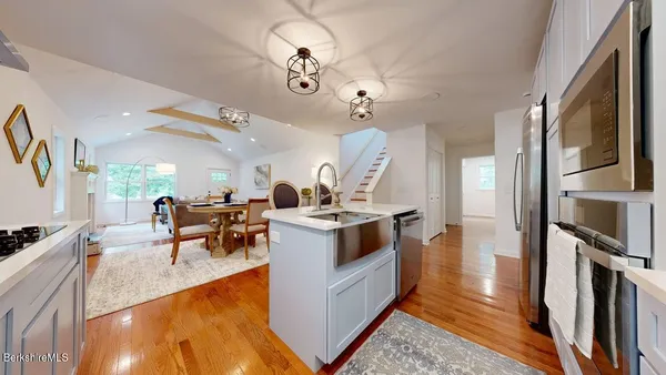 a view of living room with furniture and a flat screen tv