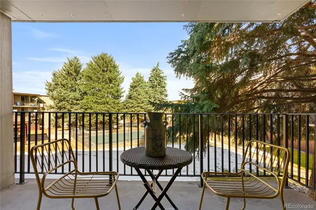 a view of a chairs and table in patio