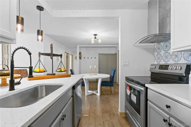 a kitchen that has a lot of cabinets in it