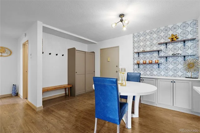 a view of kitchen with furniture and wooden floor