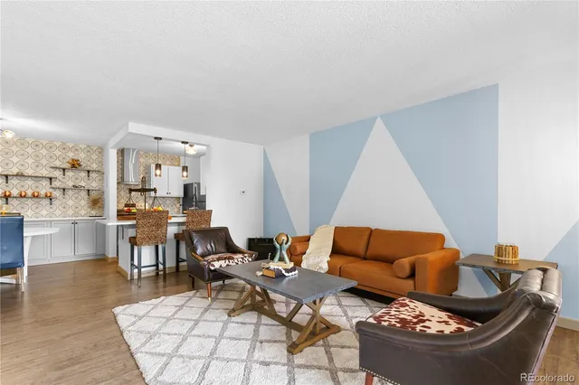 a living room with furniture and a rug