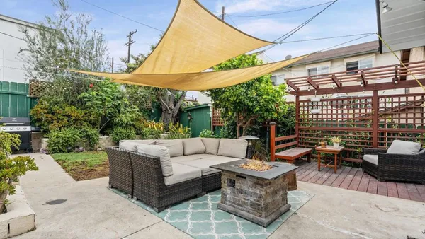 a outdoor space with the couches and a potted plant