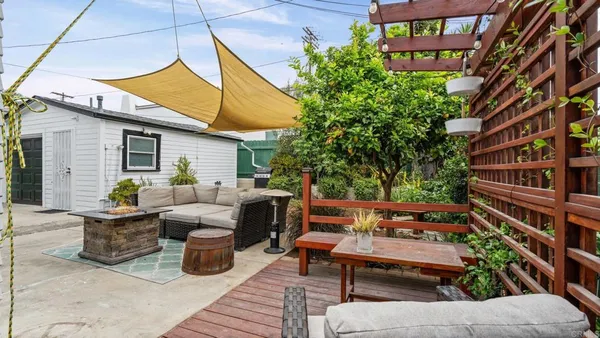 a backyard of a house with seating space