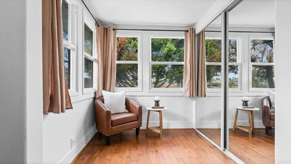 a living room with furniture and a window
