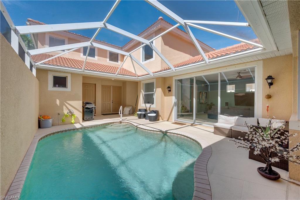 5738 Lago Villaggio Way Naples, FL 34104 - Photo 20 of 28 a view of a house with sitting area and furniture