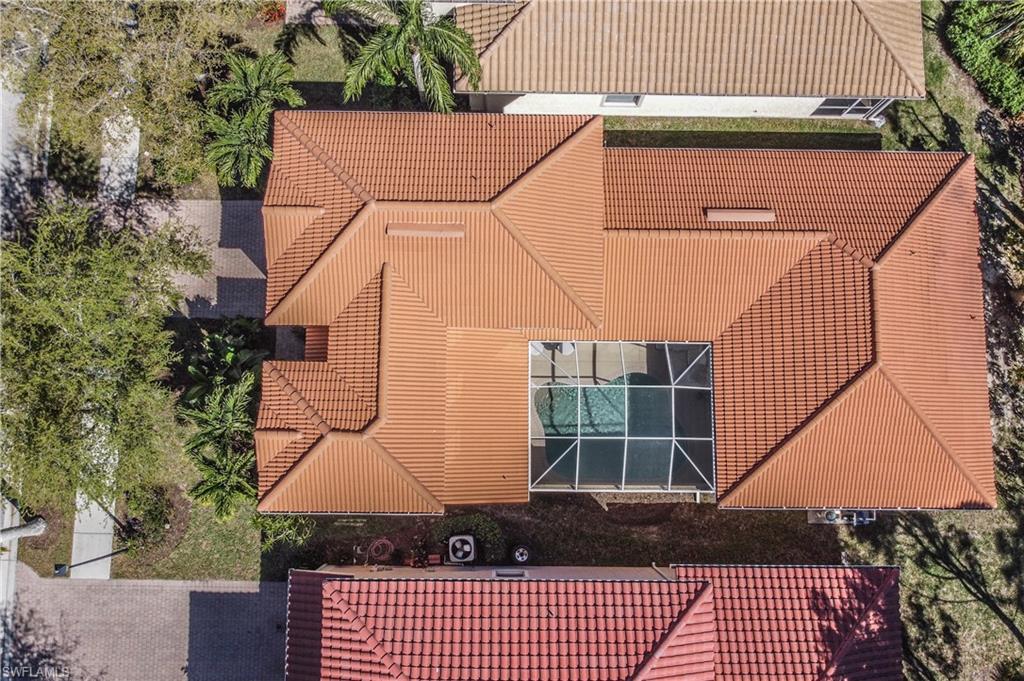 5738 Lago Villaggio Way Naples, FL 34104 - Photo 23 of 28 a view of a house with a large window