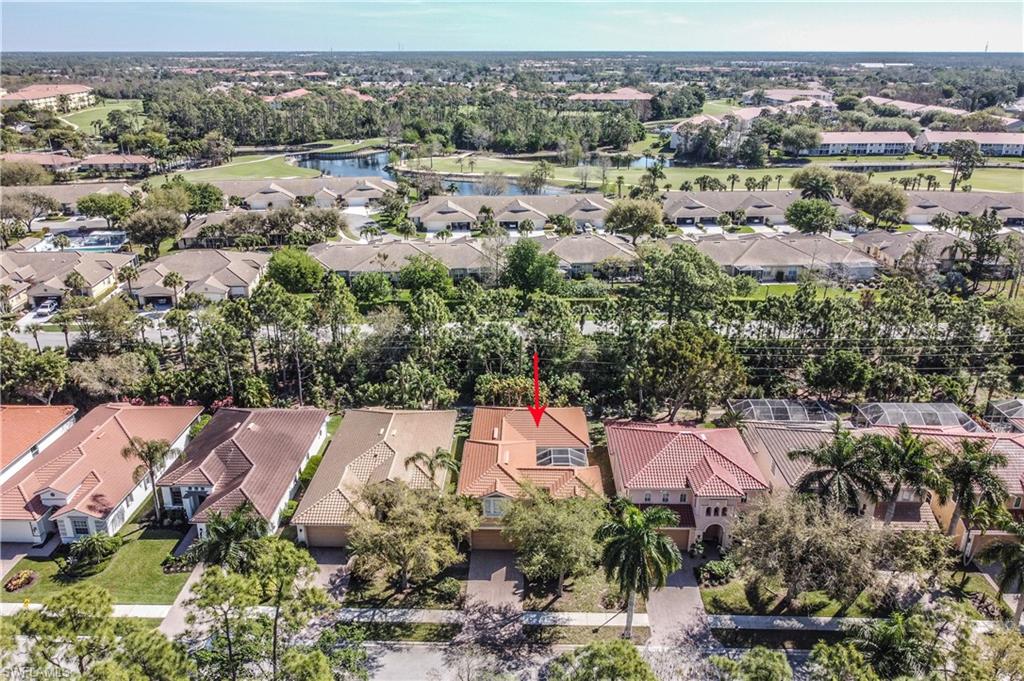 5738 Lago Villaggio Way Naples, FL 34104 - Photo 24 of 28 an aerial view of a city