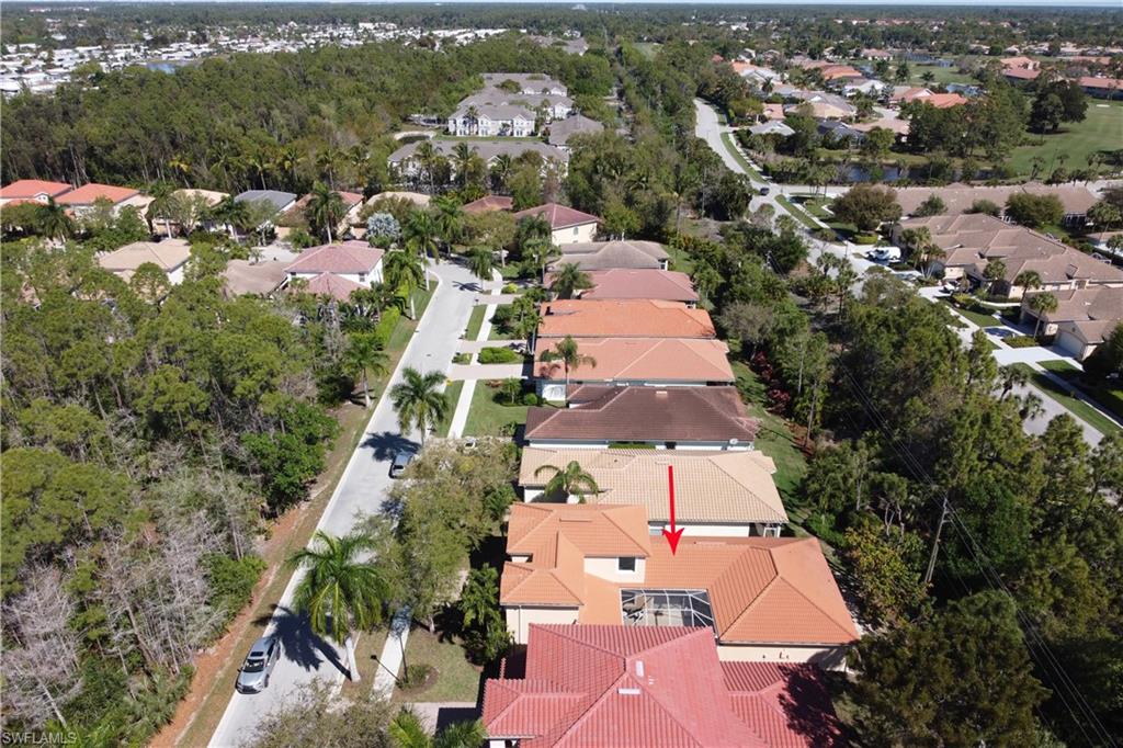 5738 Lago Villaggio Way Naples, FL 34104 - Photo 27 of 28 an aerial view of a house with a yard