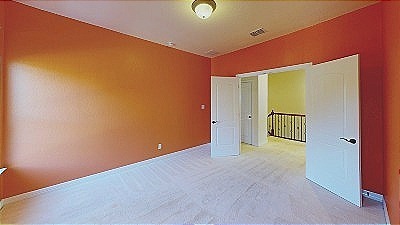 12004 Terraza Circle, Unit TH32 Austin, TX 78726 - Photo 16 of 25 an empty room with mirror and windows